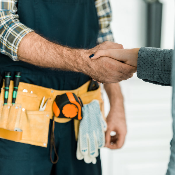 plumber shaking hands with customer