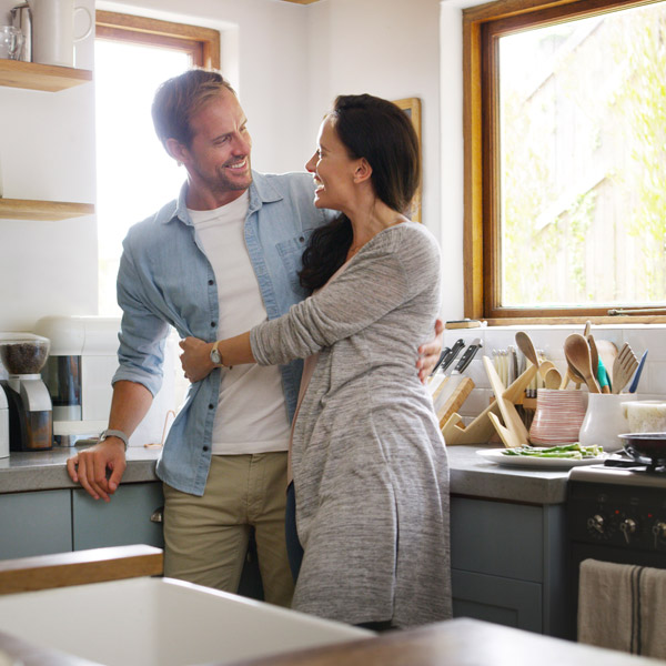 couple hugging in the kitchen