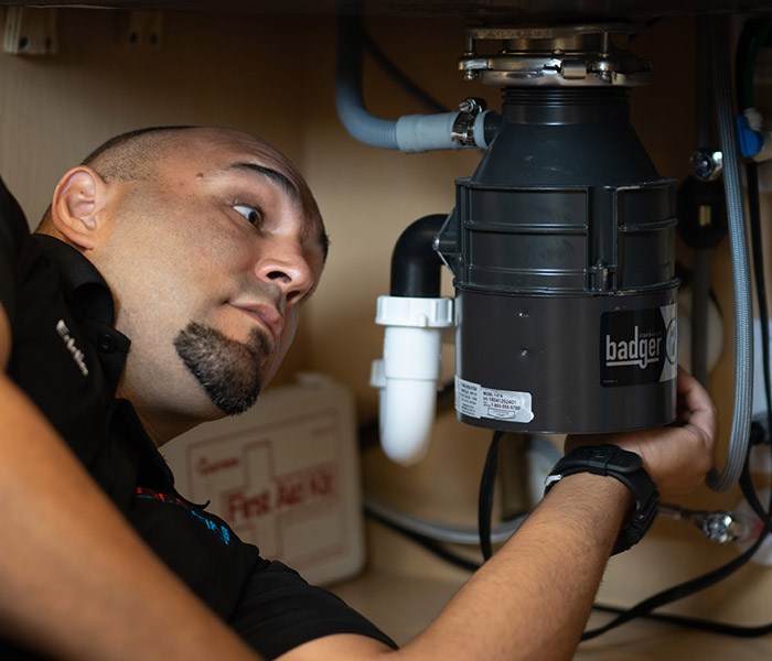 working on garbage disposal
